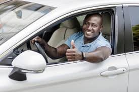 Happy customer driving away in their Finer vehicle
